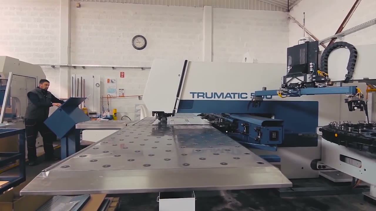 CNC metal-forming machine running at the Liva Forming shop in Delta, BC